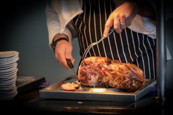 Roast joint being carved at a christmas carvery in kent