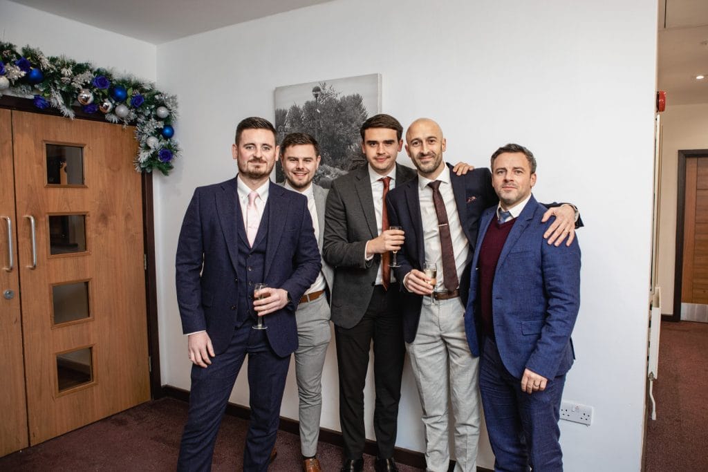 Group gathered for a photo at a function venue in dartford