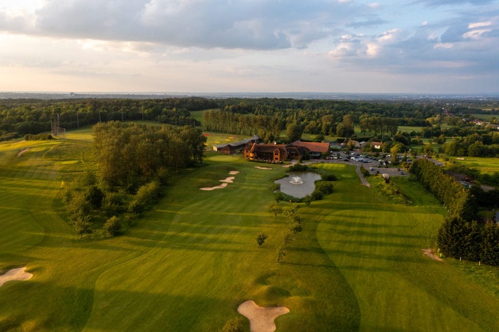 Drone footage of Birchwood Park with bunkers and skyline