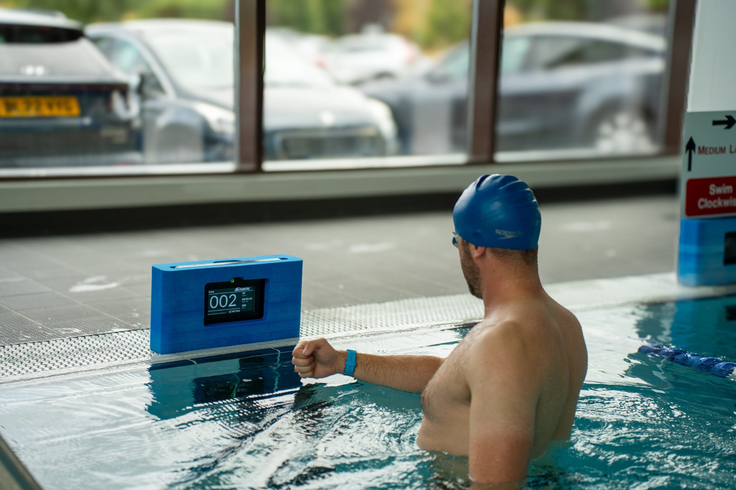 Man using Swimtag to monitor his performance at pool in dartford
