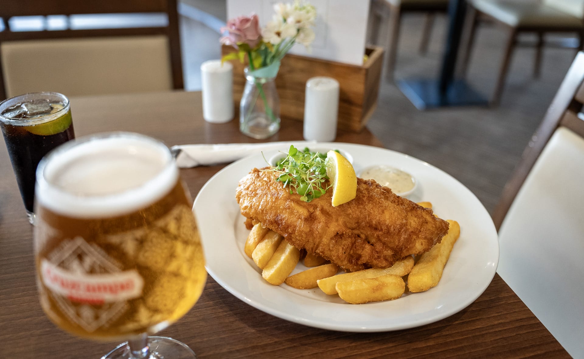 Restaurant food fish and chips and a pint of beer