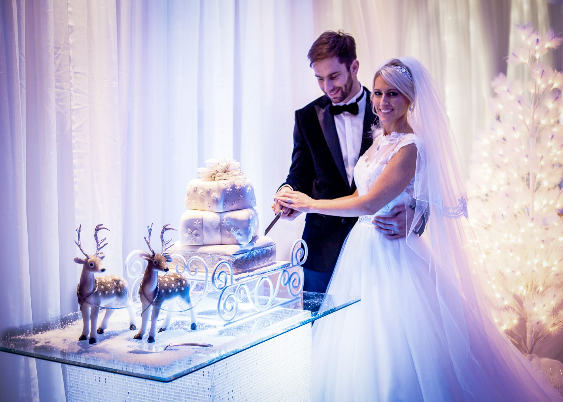 newly married couple cutting cake after wedding in dartford