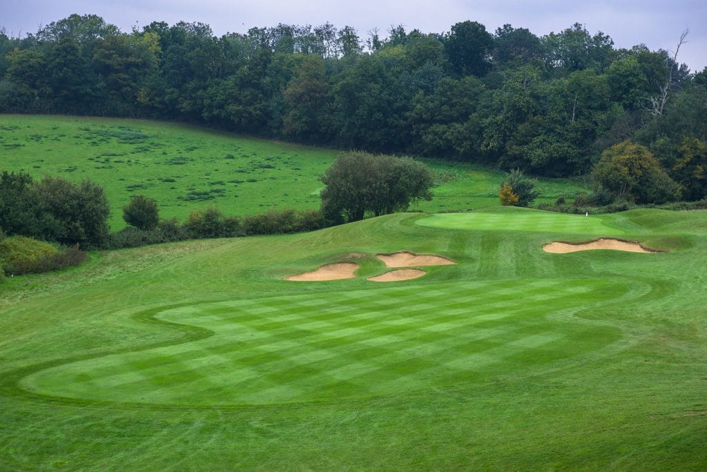 golf hole with neatly trimmed grass in kent
